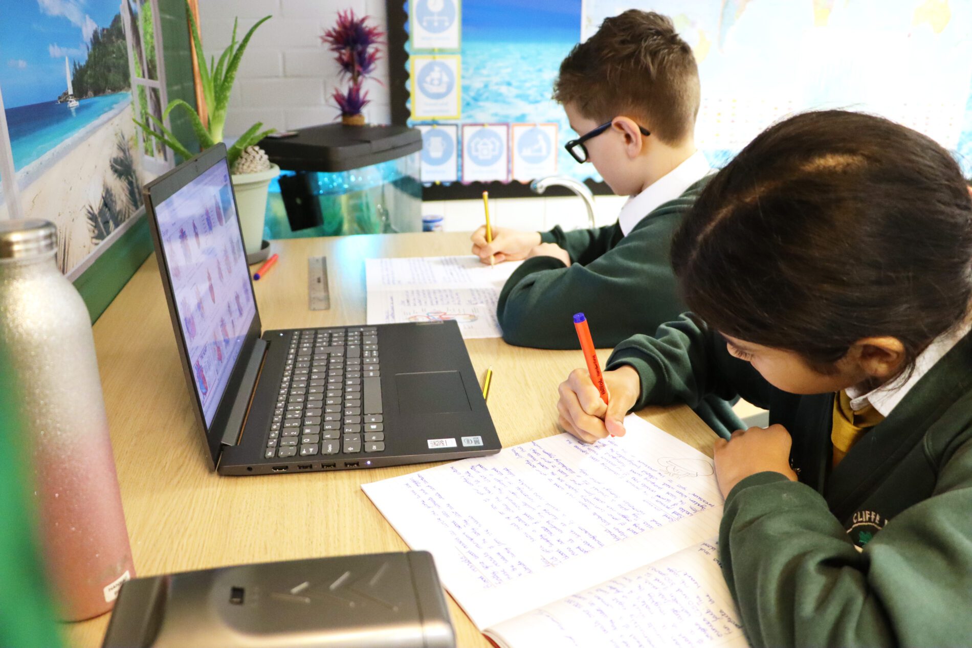 pupils using laptops for working at cliffe woods primary school