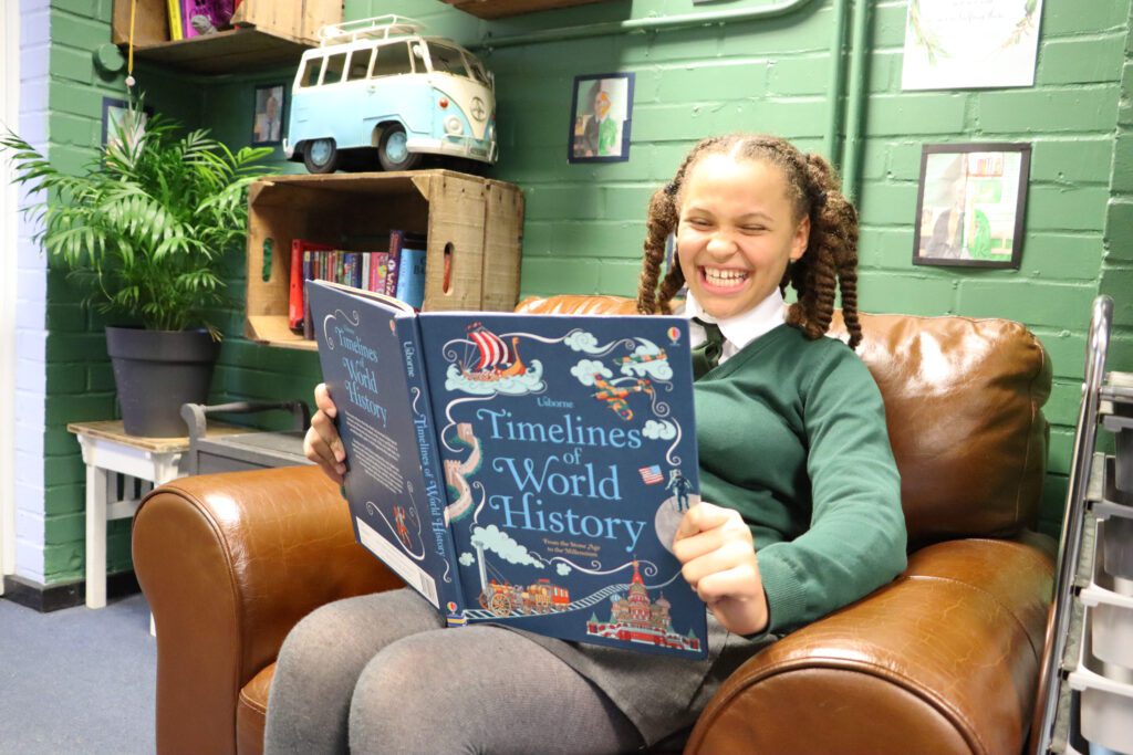 pupil reading world history in class at cliffe woods primary school
