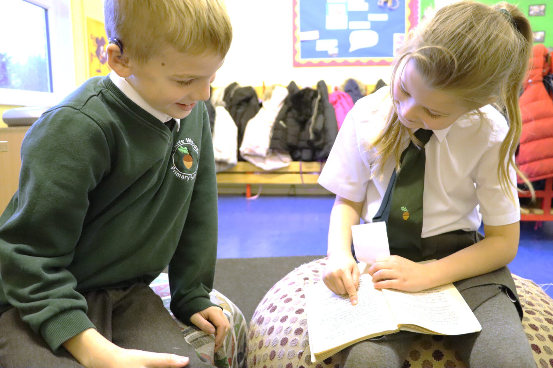 pupils reading together at cliffe woods primary school
