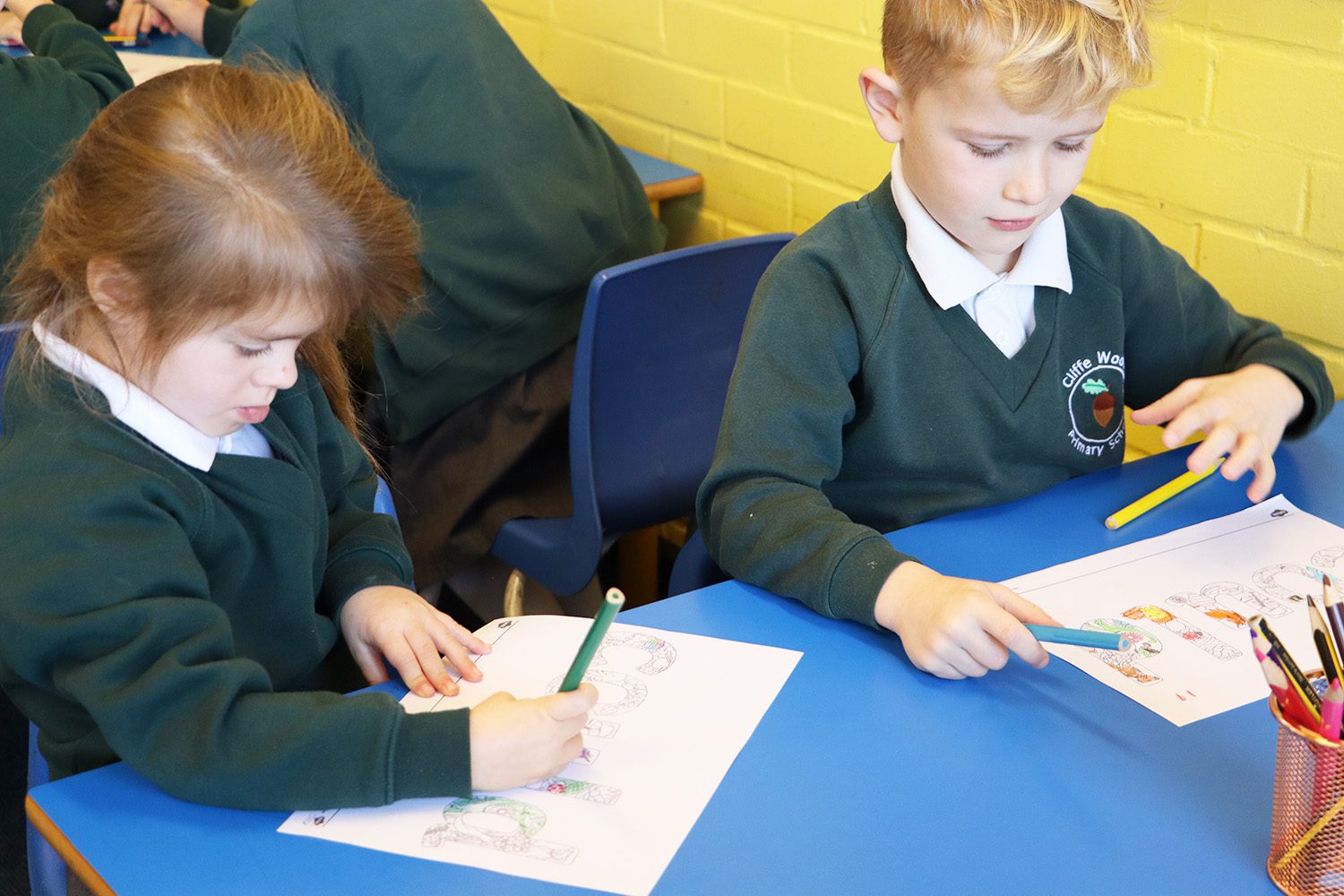 pupils colouring in phonics words