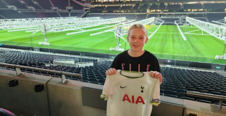 Kaylan holding Tottenham Shirt at the Stadium